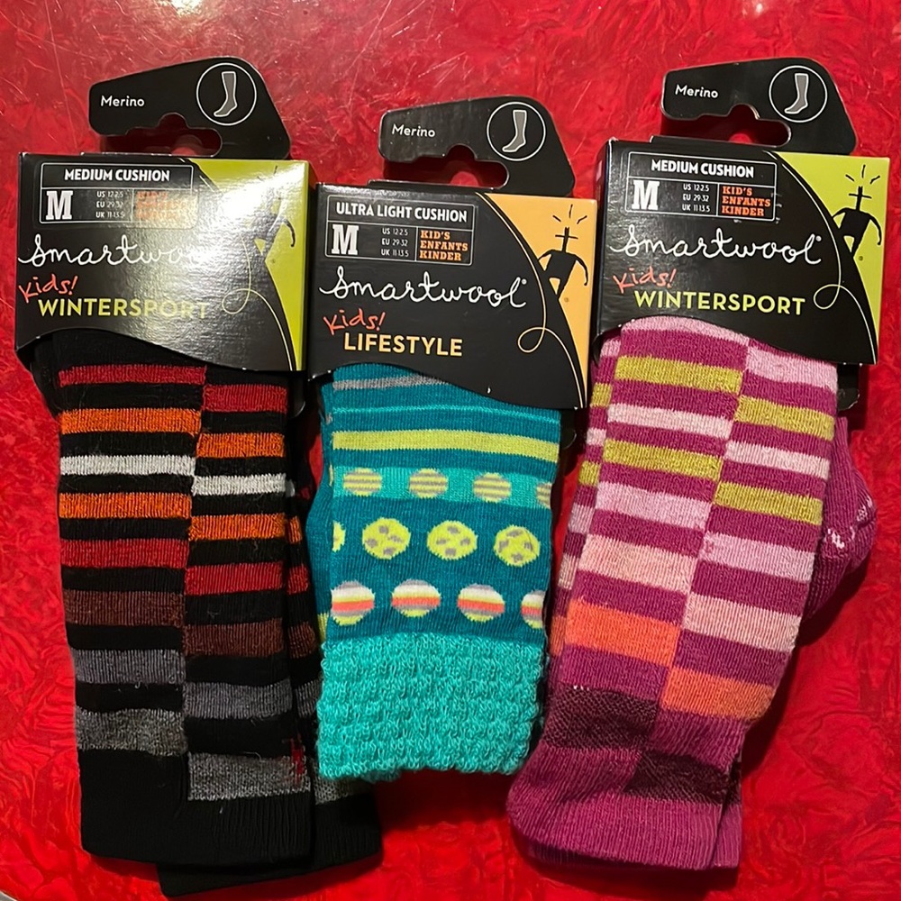 Three pairs of Smartwool sz M kids socks.